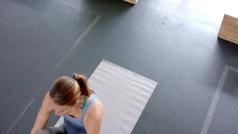 Fit-young-Caucasian-woman-exercises-on-a-mat-at-the-gym