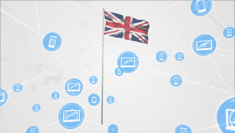 Animation-of-network-of-computer-and-smartphone-icons-over-union-jack-uk-flag-on-white-background