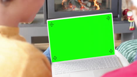 Happy-caucasian-male-friends-having-christmas-laptop-video-call,-green-screen,-slow-motion