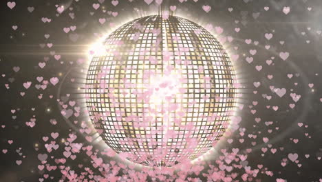 Animation-of-disco-ball-spinning-over-hearts-on-black-background