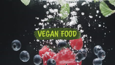 Animation-of-vegan-food-text-over-fruit-falling-in-water-background