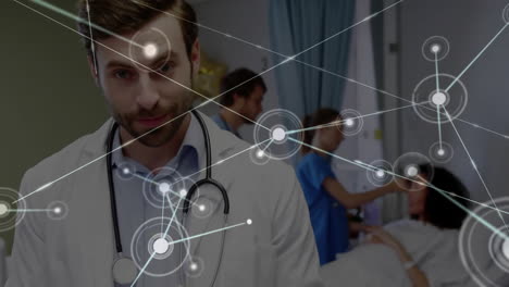 Animation-of-network-of-connections-over-caucasian-doctors-with-patient-using-tablet