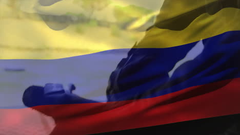Animation-of-flag-of-colombia-over-caucasian-male-soldier-wearing-gloves