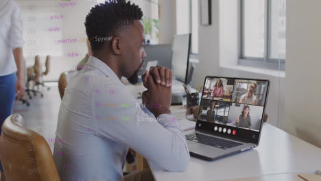 Animation-of-data-processing-over-african-american-man-having-laptop-video-call-at-office