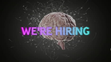 Animation-of-we're-hiring-text-and-connections-with-human-brain-over-black-background