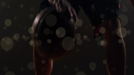 Animation-Eines-Afroamerikanischen-Basketballspielers-Mit-Ball-Und-Lichtpunkten-Auf-Schwarzem-Hintergrund