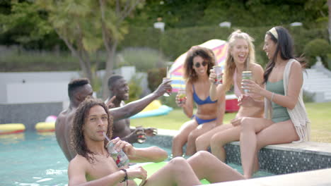 Diverse-young-adults-enjoy-a-pool-party-outdoors