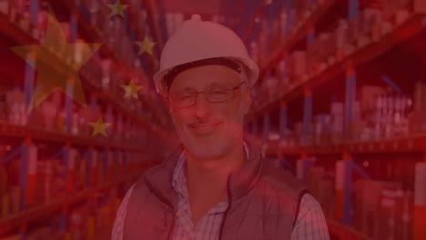 Animation-of-flag-of-china-over-senior-caucasian-worker-smiling-in-warehouse