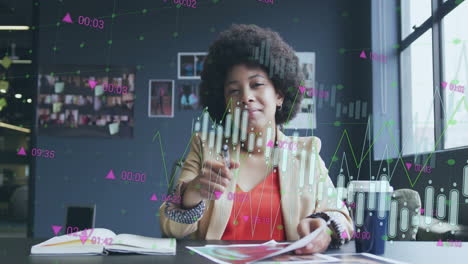 Animation-of-financial-data-processing-over-african-american-businesswoman-in-office