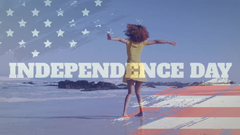 Animation-of-independence-day-text,-american-flag-and-happy-african-american-woman-on-sunny-beach