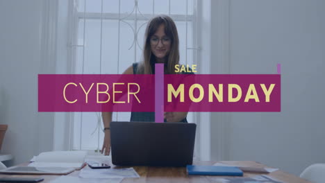 Animation-of-cyber-monday-text-over-caucasian-businesswoman-using-laptop-in-office