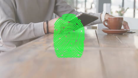 Animation-of-fingerprint-over-caucasian-woman-using-smartphone-in-cafe