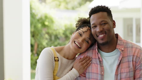 Portrait-of-happy-african-american-couple-embracing-in-garden-at-home,-slow-motion