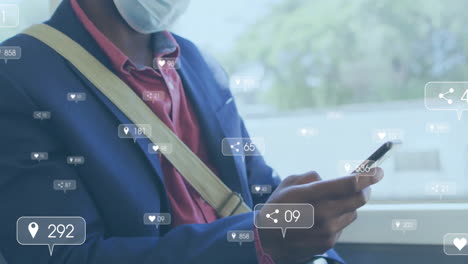 Animation-of-media-notifications-and-african-american-man-in-face-mask-using-smartphone-on-bus