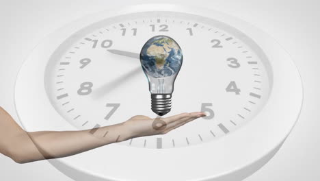 Animation-of-hand-with-light-bulb-and-planet-earth-over-clock-ticking-on-white-background