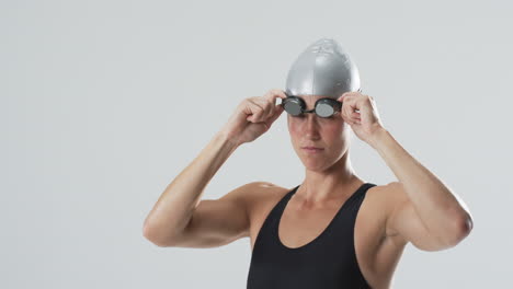 Professional-swimmer-preparing-for-a-race,-with-copy-space