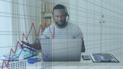 Animation-of-financial-data-processing-over-african-american-man-using-laptop
