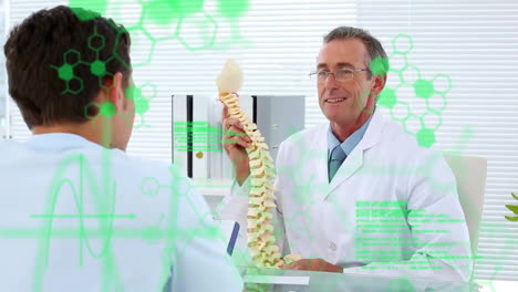 Animation-of-processing-data-over-diverse-male-doctor-and-patient-discussing-spine