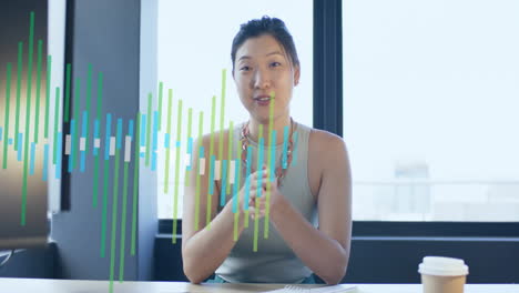 Animation-Der-Finanzdatenverarbeitung-über-Eine-Asiatische-Geschäftsfrau,-Die-Im-Büro-Arbeitet