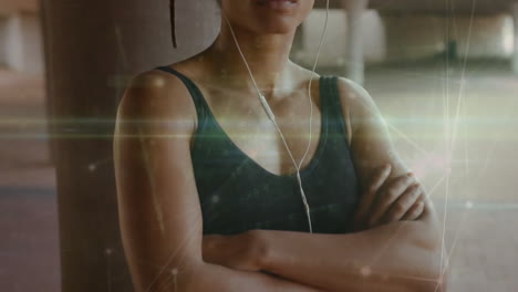 Animation-of-network-of-connections-over-biracial-woman-wearing-earphones