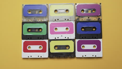 Video-of-retro-tapes-with-copy-space-on-yellow-background
