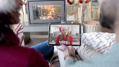 Happy-diverse-couple-and-female-friend-having-christmas-tablet-video-call,-slow-motion