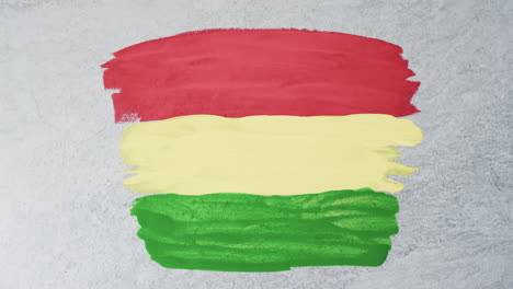 Video-of-red,-yellow-and-green-paint-smudges-with-copy-space-on-grey-background