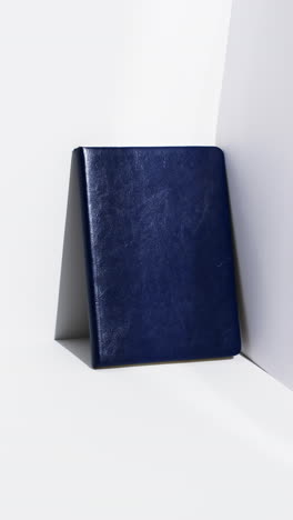 Video-of-book-in-blue-cover-with-copy-space-on-white-background