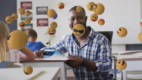 Animation-of-emoji-icons-over-diverse-schoolchildren-and-teacher
