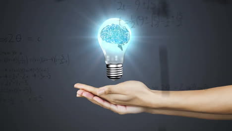 Animation-of-mathematical-data-processing-over-human-brain-in-lightbulb-over-woman's-hands