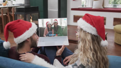 Happy-caucasian-couple,-mother-and-daughter-having-christmas-laptop-video-call,-slow-motion