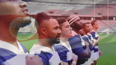 Animation-of-flag-of-costa-rica-over-diverse-male-rugby-players-at-anthem-at-stadium