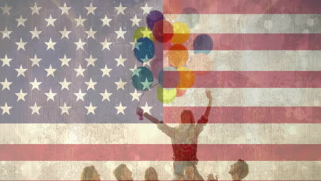 Animation-of-flag-of-usa-over-diverse-friends-holding-balloons