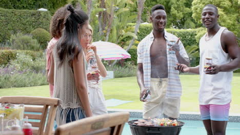 Diverse-friends-enjoy-a-barbecue-outdoors
