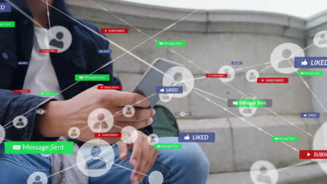 Animation-of-network-of-connections-with-icons-over-biracial-man-using-smartphone