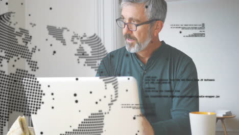 Animation-of-global-network-over-senior-caucasian-man-in-glasses-using-laptop-at-home