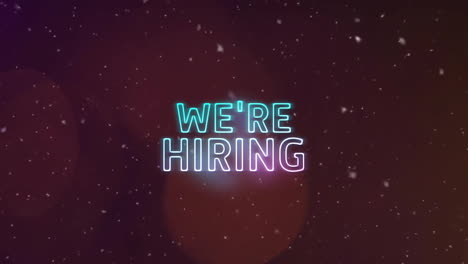 Animation-of-we're-hiring-text-over-snow-falling-and-spots