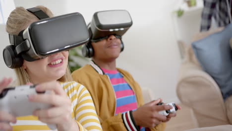 Happy-diverse-group-of-teenage-friends-with-vr-headsets-playing-video-games-at-home,-slow-motion