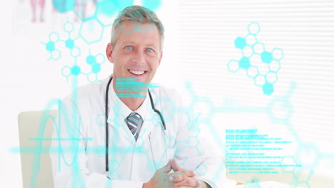 Animation-of-medical-data-processing-over-smiling-caucasian-male-doctor-at-desk