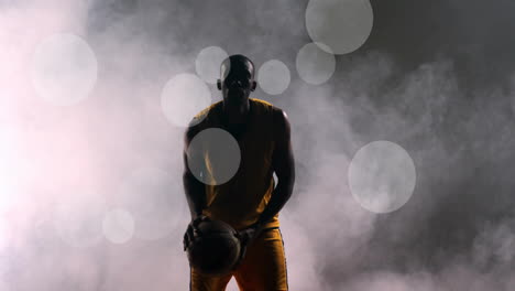 Animation-of-african-american-basketball-player-throwing-ball-and-spots-of-light-on-black-background