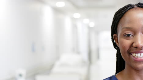 Porträt-Einer-Glücklichen-Afroamerikanischen-Ärztin,-Die-Im-Krankenhaus-Lächelt,-Kopierraum,-Zeitlupe