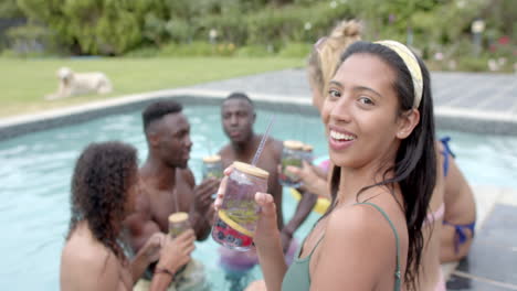 Young-biracial-woman-enjoys-a-pool-party