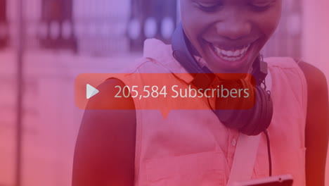 Animation-of-subscribers-text-with-growing-number-over-african-american-woman-using-smartphone