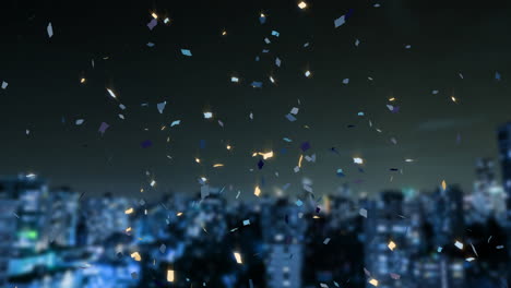 Animation-of-confetti-and-cityscape-on-black-background
