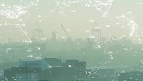 Animation-of-numbers-around-connected-dots-over-aerial-view-of-fog-covered-cityscape