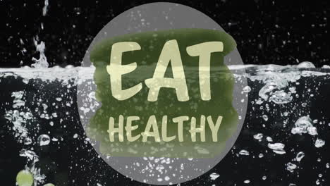 Animation-of-eat-healthy-text-over-fruit-falling-in-water-background