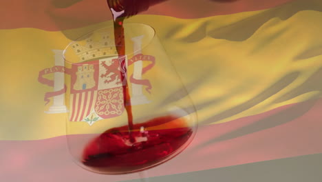 Compuesto-De-Vino-Tinto-Que-Se-Vierte-En-Un-Vaso-Sobre-El-Fondo-De-La-Bandera-De-España