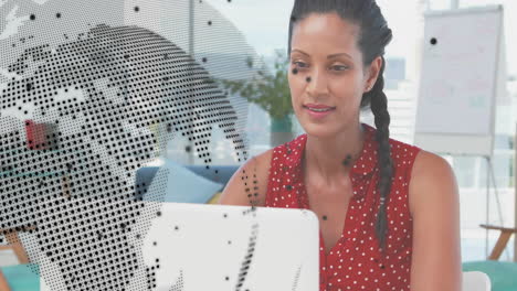 Animation-of-global-network-and-data-over-happy-biracial-casual-businesswoman-using-laptop-at-office