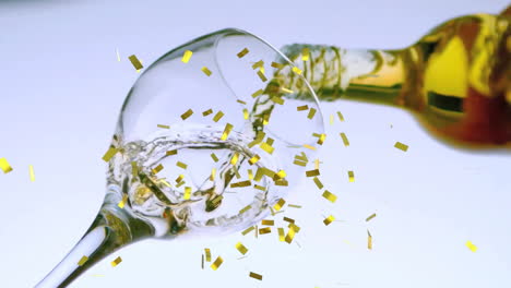 Animation-of-confetti-falling-over-white-wine-glass