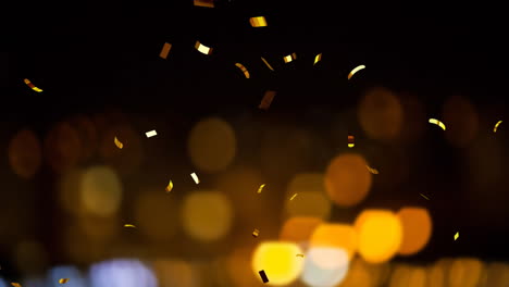 Animation-of-confetti-and-spot-lights-on-black-background